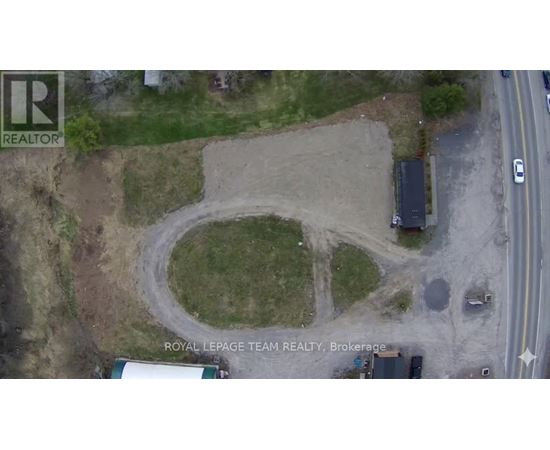 An aerial view of a construction site with a large circular area in the center.