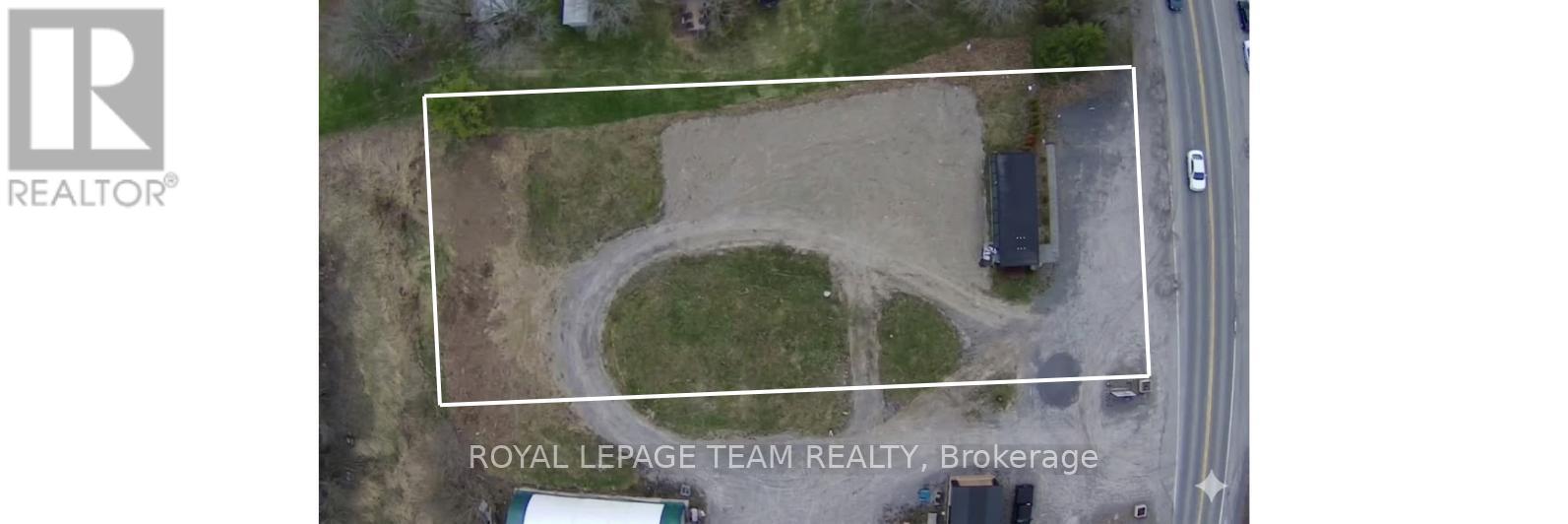 An aerial view of a property with a white rectangle highlighting a specific area.