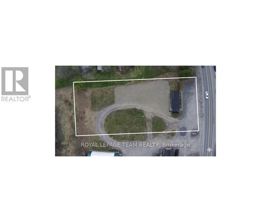 An aerial view of a property with a white rectangle highlighting a specific area.