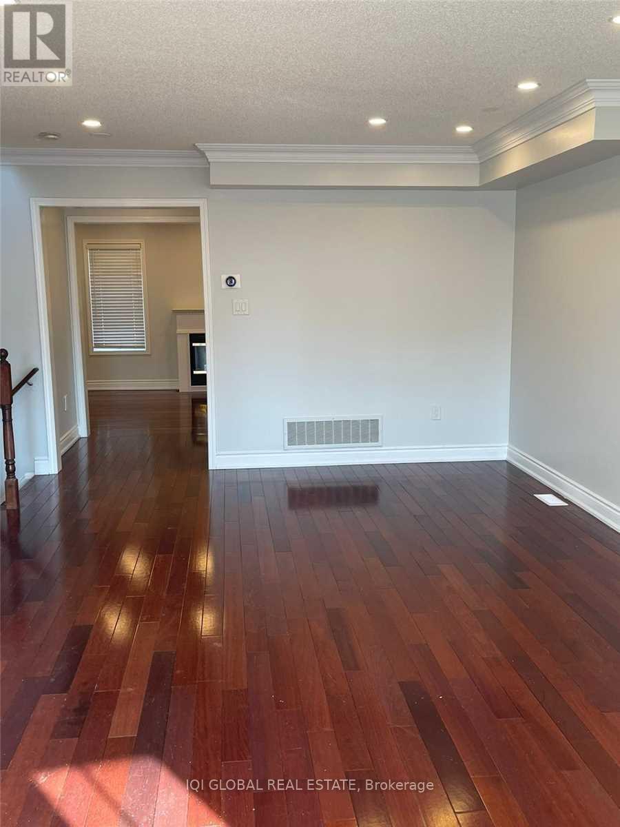 A room with wooden floors and white walls.