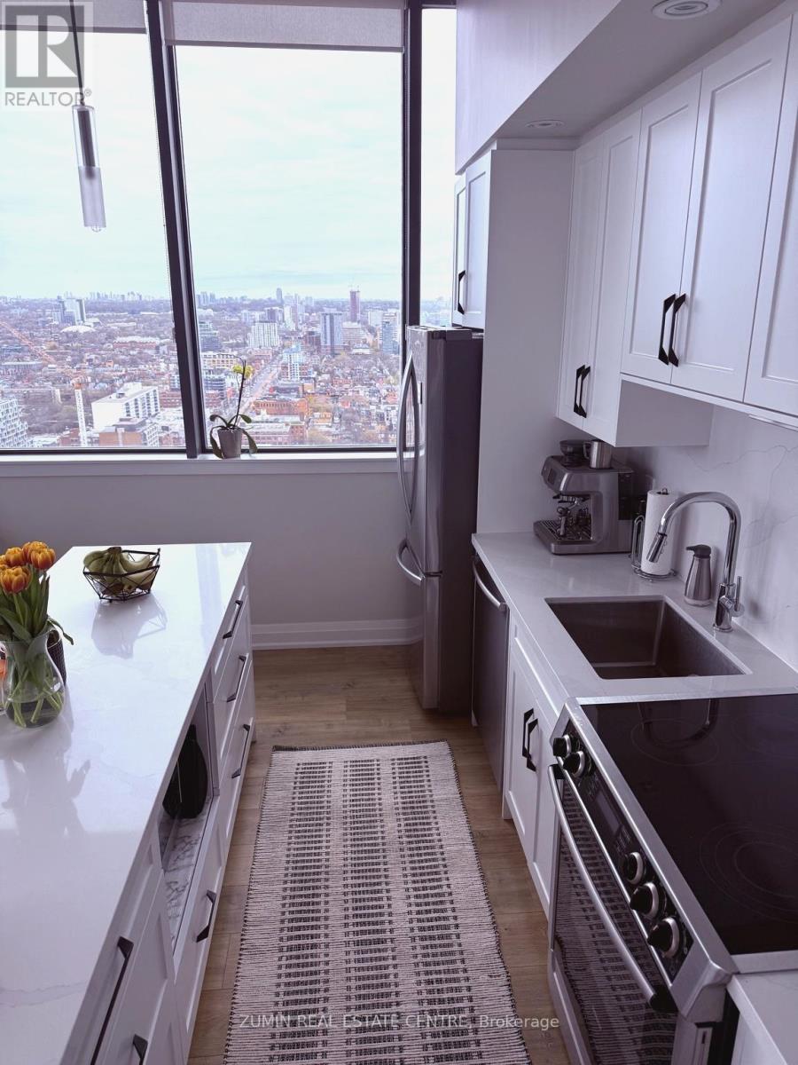 A kitchen with a view of the city.
