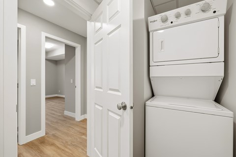 A white oven and dishwasher in a kitchen.