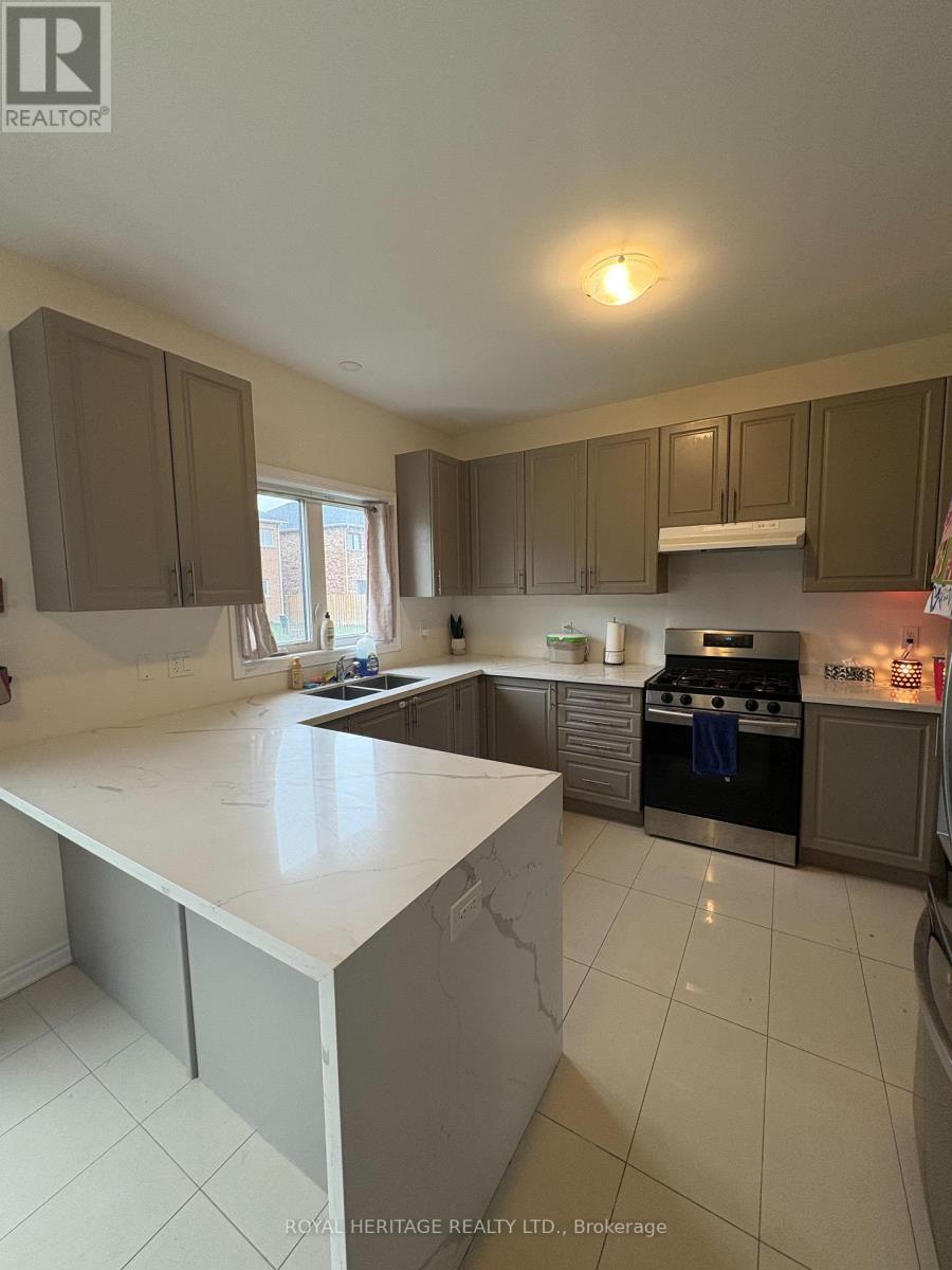 A kitchen with a white counter top and brown cabinets.