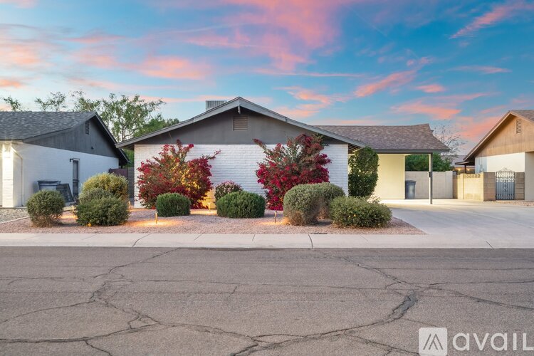 A house with a driveway in front of it.