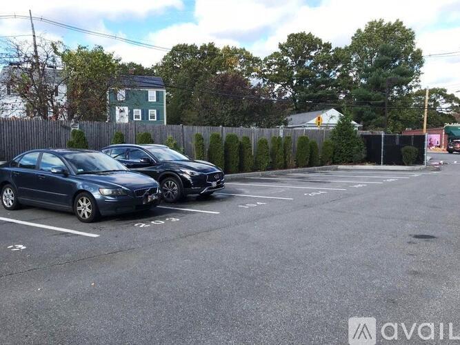 Two cars parked in a parking lot.