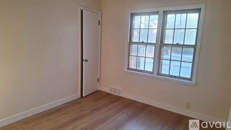 A room with a door and a window.