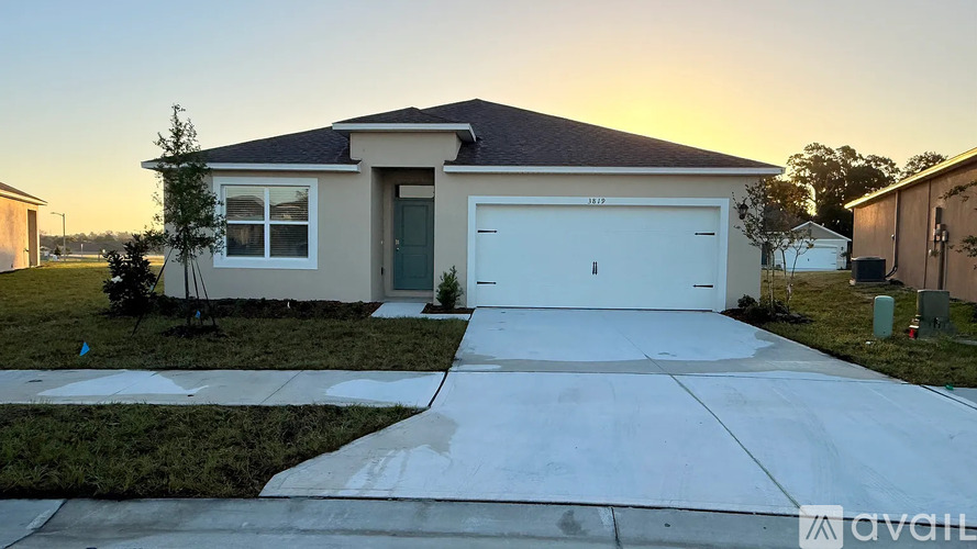 A house with a white garage door is for sale.