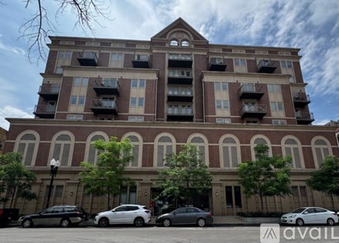 A large building with a balcony on the second floor.