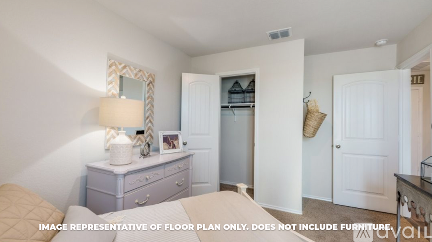 A bedroom with a dresser and mirror.