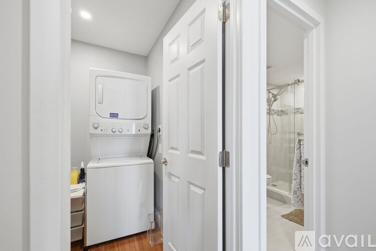 A white oven and microwave in a small kitchen.