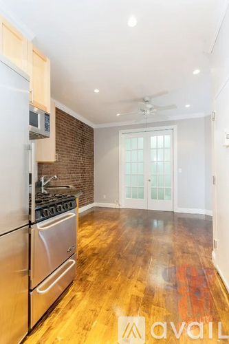 A kitchen with a stove top oven and microwave.