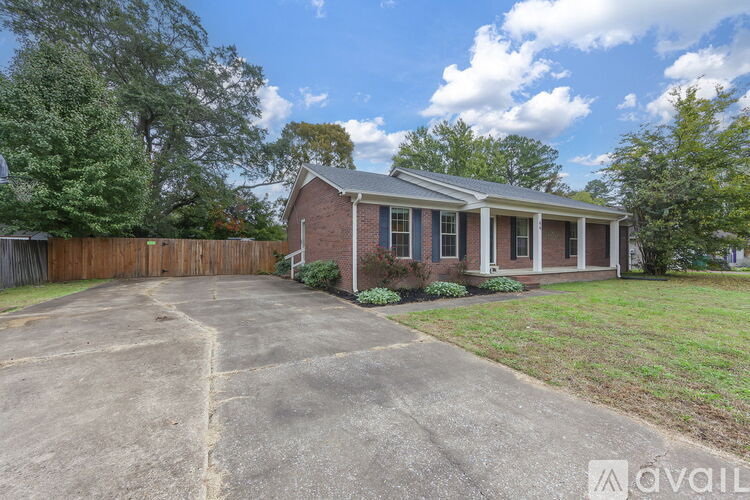 A house with a driveway in front of it.