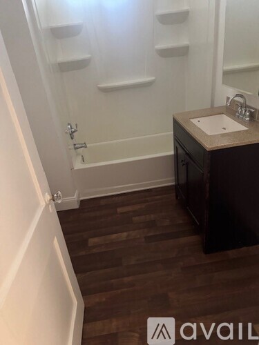 A bathroom with a sink and a bathtub.