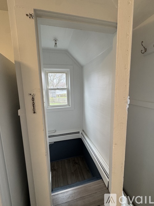 A small room with a window and a door.