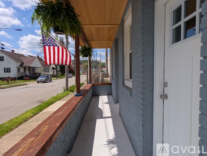 A house with a flag on the porch.