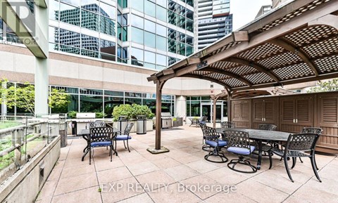 A patio area with tables and chairs is shown.