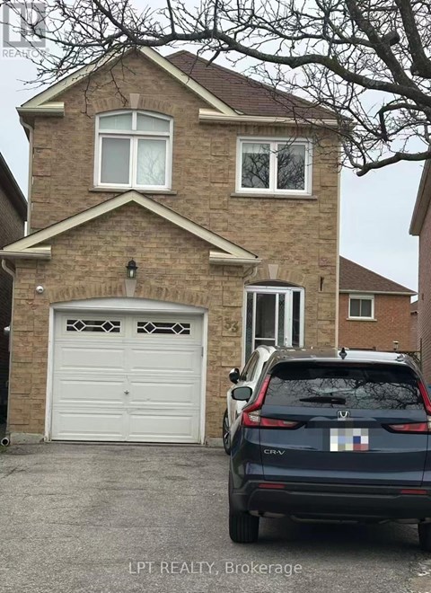 A house with a car parked in front of it.