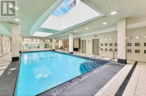 A large indoor swimming pool with the name "Stellar" written on the bottom.