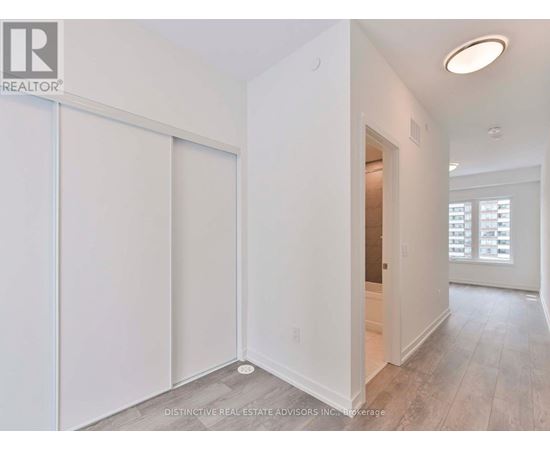 A white room with a sliding door and a window.