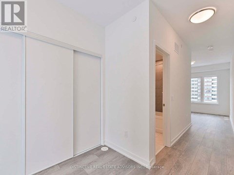 A white room with a sliding door and a window.