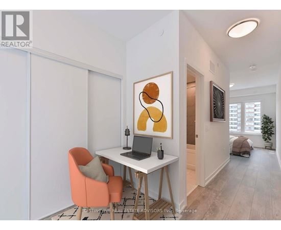 A room with a desk, chair, and painting.