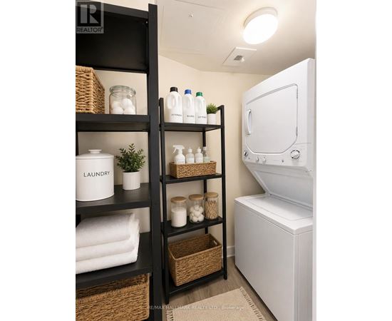 A laundry room with a washer and dryer, and a shelf with laundry supplies.