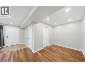 A room with wooden floors and white walls.