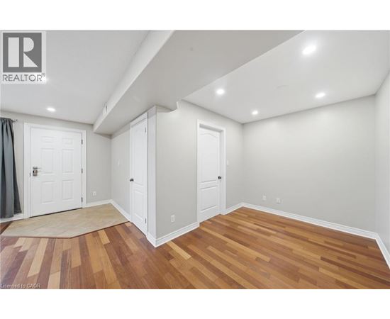A room with wooden floors and white walls.