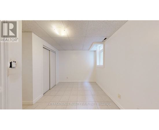 A white room with a door and a window.