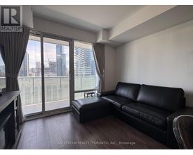 A bedroom with a large bed and a view of the city.