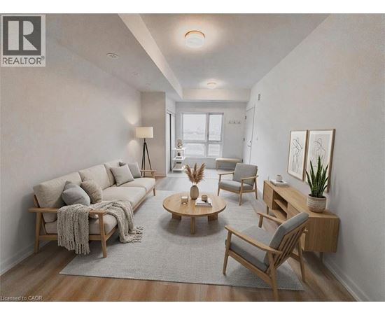 A well-lit living room with a sofa, armchairs, and a coffee table.