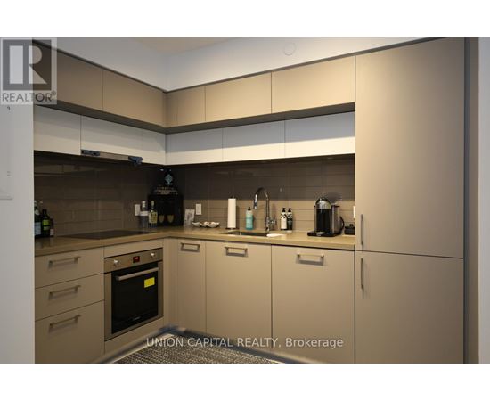 A modern kitchen with Union Capital Realty Brokerage logo.