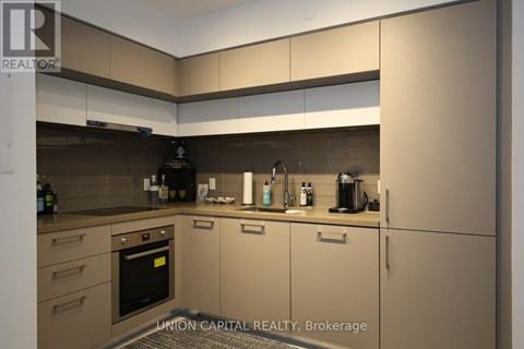 A modern kitchen with Union Capital Realty Brokerage logo.