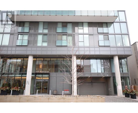 A modern building with glass windows and a sign that reads "99 Foxbar".