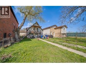 A realtor photo of a house with a yard.