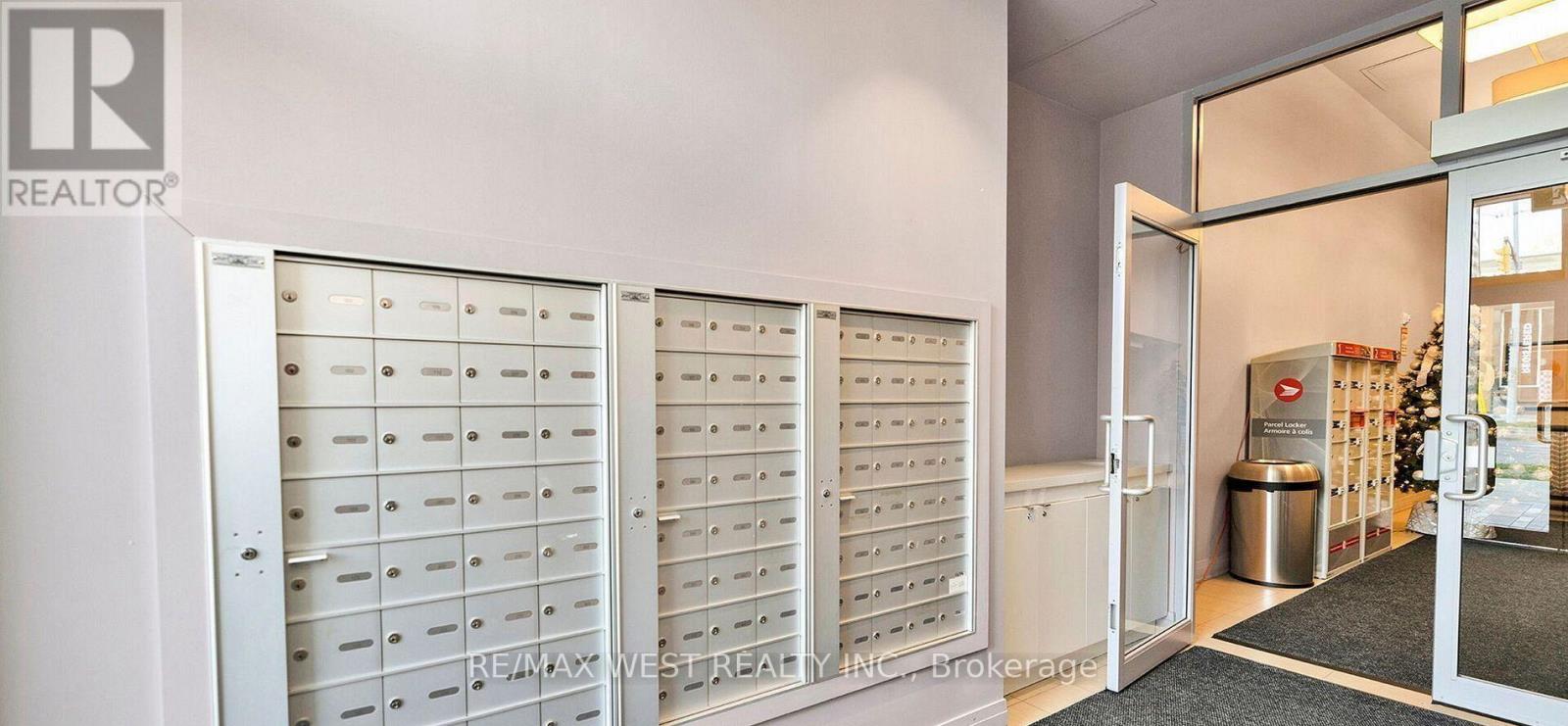 A white door with a mailbox on the side.