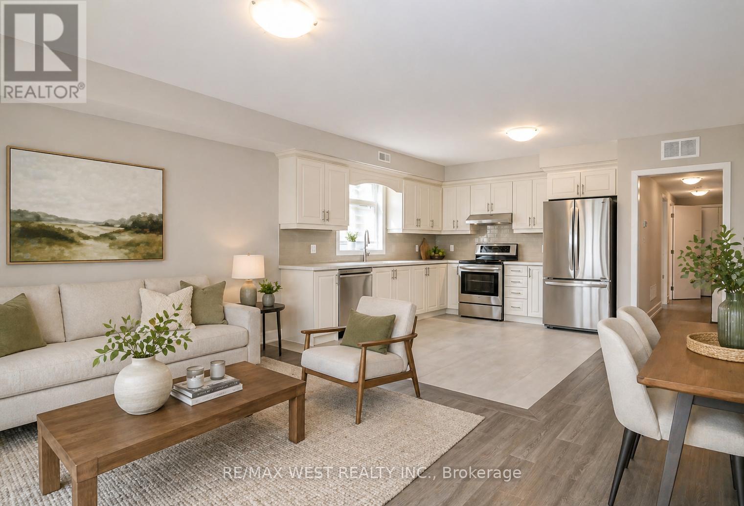 A well-lit, modern kitchen and living room with a dining area.