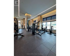 A gym with a variety of equipment including treadmills, weights, and exercise machines.