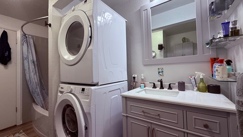 A laundry room with a washer and dryer.