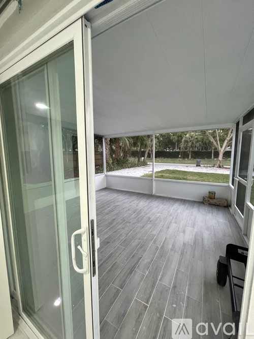 A glass door with a handle is open.
