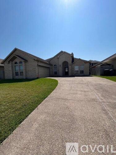 A house with a driveway in front of it.
