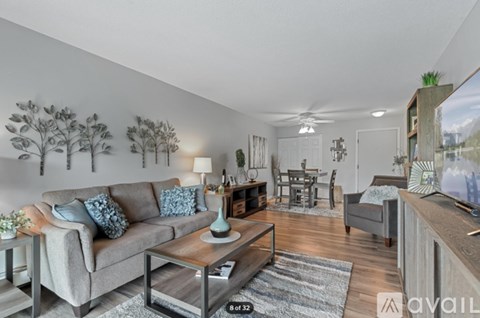 A living room with a grey couch and a coffee table.