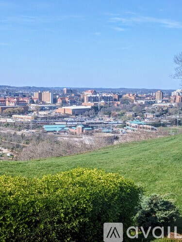 A cityscape with buildings and a clear sky.