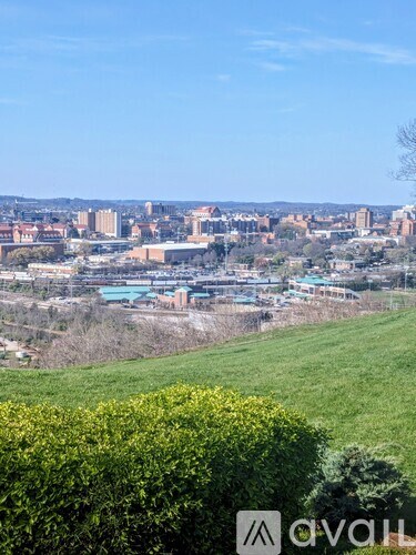 A cityscape with buildings and a clear sky.