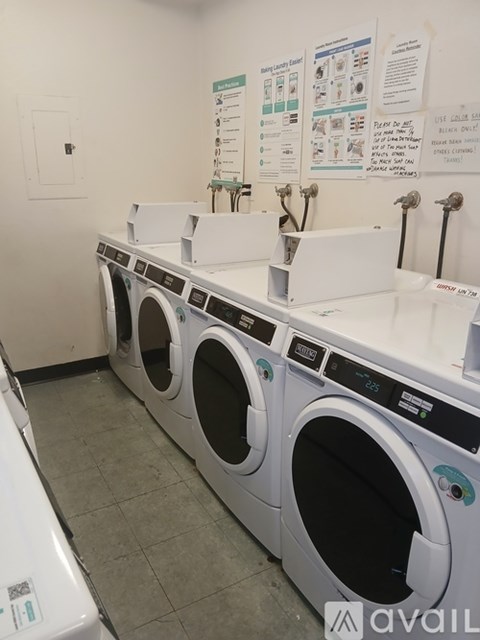 A row of washing machines in a laundromat.