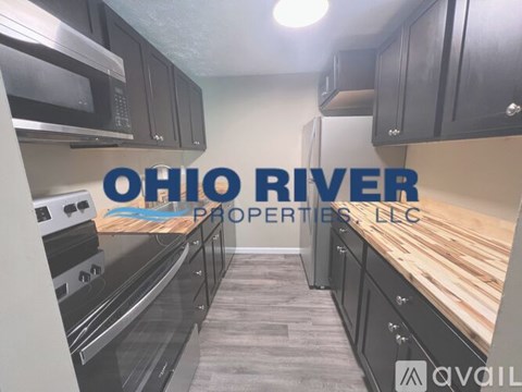 A kitchen with the words Ohio River Properties LLC on the wall.