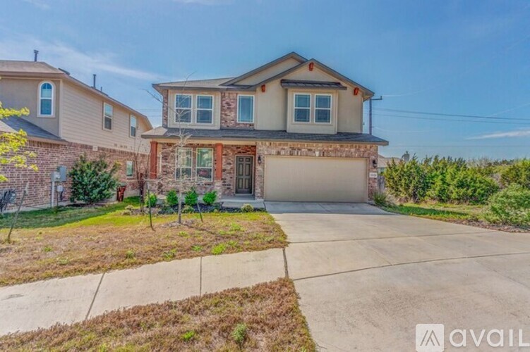A house with a garage is available for sale.