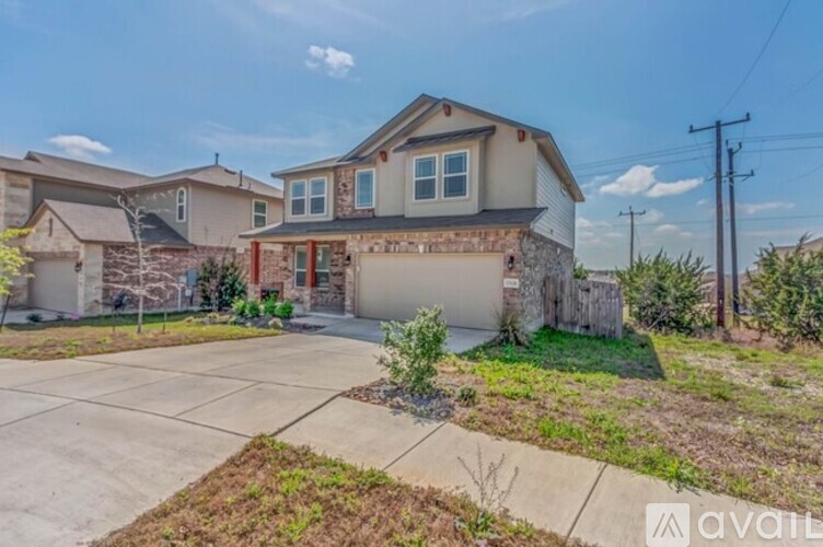 A house with a garage is available for sale.