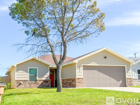 A house with a tree in front of it.