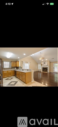 A modern kitchen with wooden cabinets and a large island.
